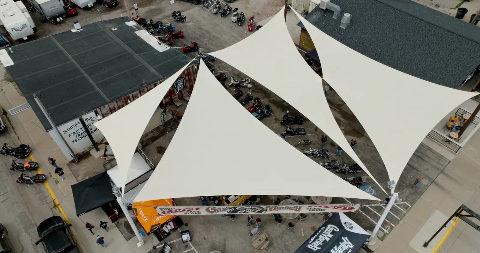 Large-scale commercial shade sails over an outdoor venue