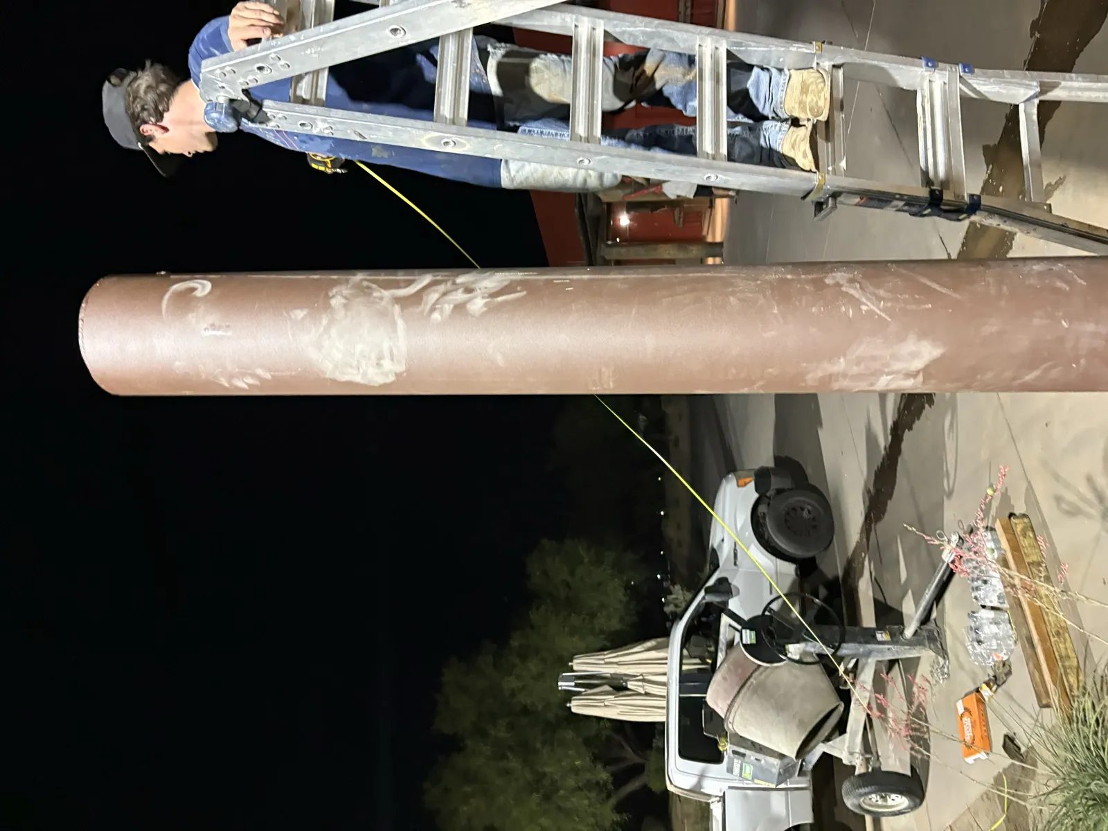 Apex crew installing a shade sail structure on site